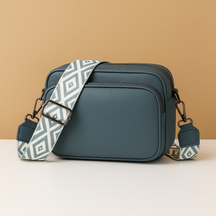 Women’s chic leather crossbody bag in PU with zippered compartments and water-resistant finish, perfect for elegant everyday wear.
