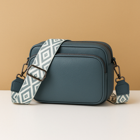 Women’s chic leather crossbody bag in PU with zippered compartments and water-resistant finish, perfect for elegant everyday wear.