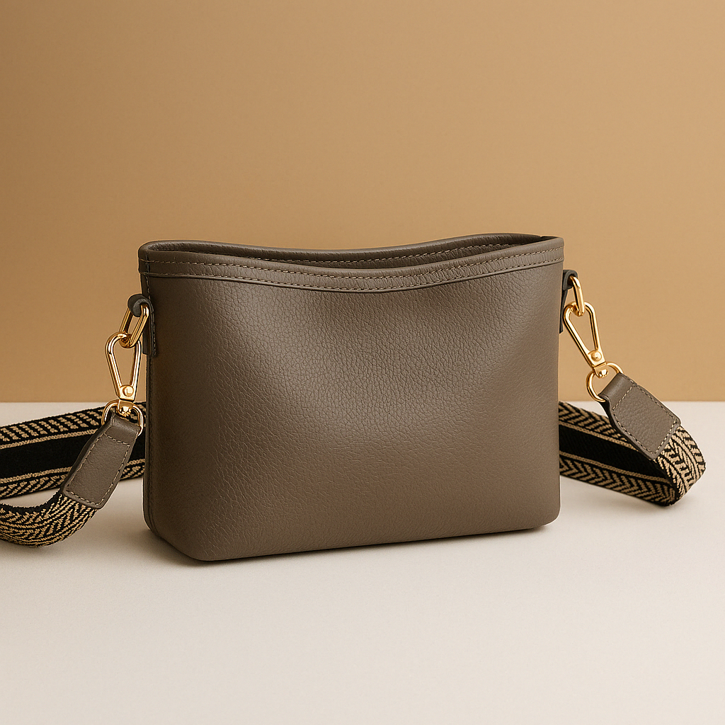 Versatile sling bag for women made from durable synthetic leather, featuring an adjustable strap and roomy interior for everyday use.