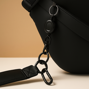 Anti-theft sling bag for men made of waterproof vegan leather with magnetic closure, zip compartments, and ergonomic strap—perfect for commuting or travel.